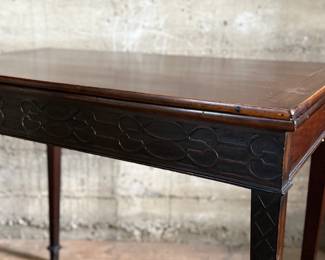 This lot features an antique George III solid mahogany game table. This table is in good overall condition, but does have one loose leg shown in photos. This table measures closed, 29” H x 19” W x 36” D and open, 29” H x 38” W x 36” D.
