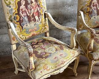 This lot features a pair of 19th century French Louis XV style armchairs with original tapestry upholstery and a painted, carved wood frame. Each chair measures, 41” H x 25” W x 21.5” D.
