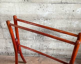 This lot features a Victorian bent wood towel rail that measures, 34” H x 25.5” W x 12” D.
