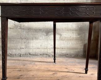 This lot features an antique George III solid mahogany game table. This table is in good overall condition, but does have one loose leg shown in photos. This table measures closed, 29” H x 19” W x 36” D and open, 29” H x 38” W x 36” D.
