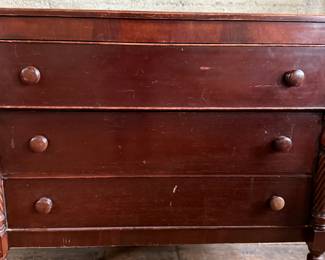 This lot features a 19th century American Empire mahogany chest of drawers that measures, 38” H x 46” W x 20” D.
