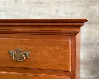 This lot features a solid cherry wood Chippendale-style chest of drawers with original brass pulls that measures, 37.5” H x 41” W x 19.5” D.
