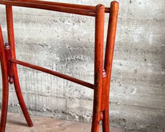 This lot features a Victorian bent wood towel rail that measures, 34” H x 25.5” W x 12” D.
