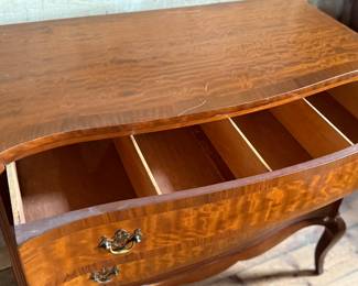 This lot features an antique George III style burr walnut serpentine chest of drawers that measures, 34” H x 38” W x 19” D.
