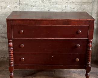 This lot features a 19th century American Empire mahogany chest of drawers that measures, 38” H x 46” W x 20” D.
