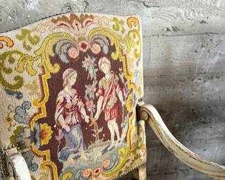 This lot features a pair of 19th century French Louis XV style armchairs with original tapestry upholstery and a painted, carved wood frame. Each chair measures, 41” H x 25” W x 21.5” D.
