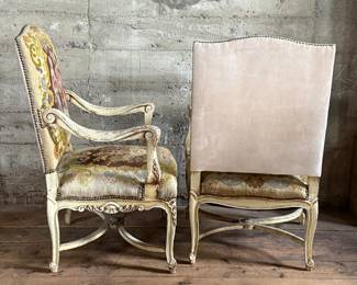 This lot features a pair of 19th century French Louis XV style armchairs with original tapestry upholstery and a painted, carved wood frame. Each chair measures, 41” H x 25” W x 21.5” D.

