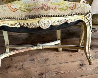 This lot features a pair of 19th century French Louis XV style armchairs with original tapestry upholstery and a painted, carved wood frame. Each chair measures, 41” H x 25” W x 21.5” D.
