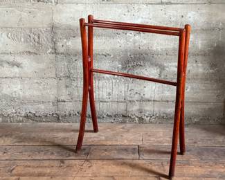 This lot features a Victorian bent wood towel rail that measures, 34” H x 25.5” W x 12” D.
