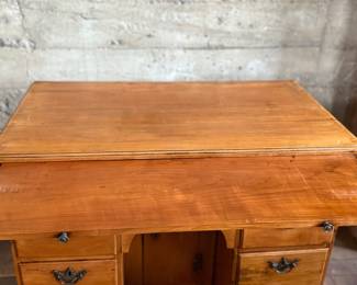 This lot features a rare 18th century Georgian style kneehole desk that measures, 33.5” H x 36.5” W x 20.5” D.

