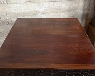 This lot features an antique George III solid mahogany game table. This table is in good overall condition, but does have one loose leg shown in photos. This table measures closed, 29” H x 19” W x 36” D and open, 29” H x 38” W x 36” D.
