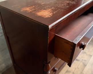 This lot features a 19th century American Empire mahogany chest of drawers that measures, 38” H x 46” W x 20” D.
