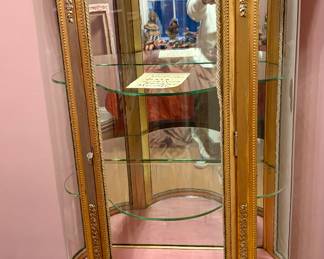 Victorian Gilt wood curved glass panels display cabinet. Antique showcase shelves intricate gold leaf trim. Vintage charm!
Excellent shape.