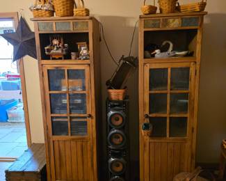 Pair of tall cabinets with glass doors.