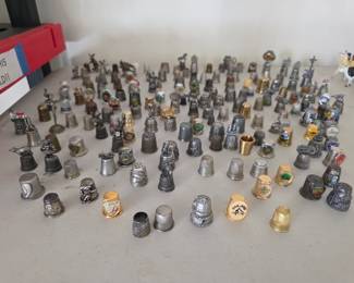 More thimbles. Some are sterling silver and Pewter. 