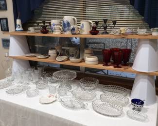 Selection of Fostoria American serving pieces and Bluebonnet pottery