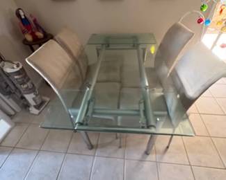 Extendable glass table with chairs- very unique- beveled glass
