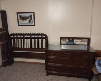 Antique Jenny Lind bed w/rails and glass top dresser with mirror.