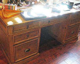 Traditional Wooden Executive Desk with Multiple Drawers and a rich, Dark Wood Finish.