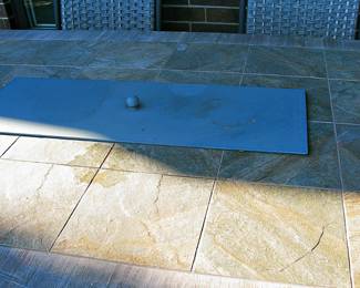  Outdoor Dining set Featuring Table with a Fire Pit Insert and Coordinating Woven-Rattan  Swivel Chairs. 