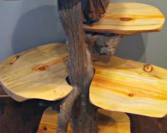 Display Stand Crafted from a Natural, Unfinished Tree Trunk and Branches Irregular-Shaped Wooden Shelves