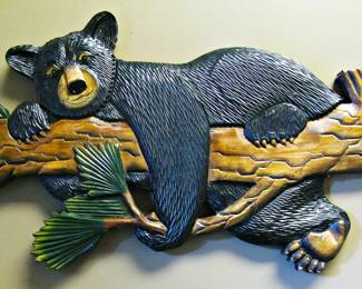 Hand-Carved Wood Piece Featuring a Black Bear Lounging on a Tree Branch. 