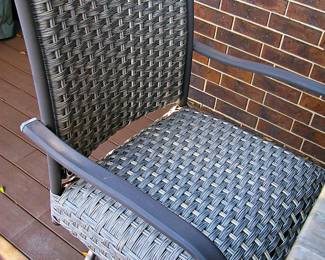  Outdoor Dining set Featuring Table with a Fire Pit Insert and Coordinating Woven-Rattan  Swivel Chairs. 