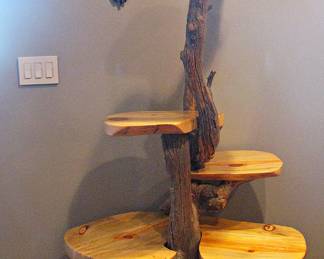 Display Stand Crafted from a Natural, Unfinished Tree Trunk and Branches Irregular-Shaped Wooden Shelves