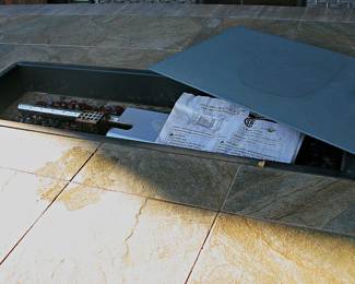  Outdoor Dining set Featuring Table with a Fire Pit Insert and Coordinating Woven-Rattan  Swivel Chairs. 