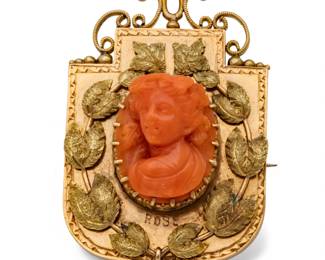 Lot 59
Victorian Gold and Carved Coral Brooch with Photo Locket 1900, H 1.7" W 1.2" 15.8 g 1 PC