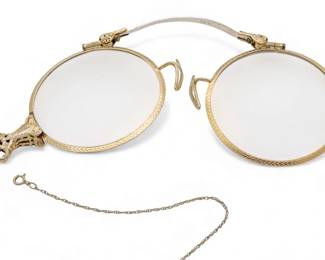 Lot 79
14K Yellow Frame Gold Spectacles, Plus Chain 1900, W 4" L 17" 19.3 g 2 PCS