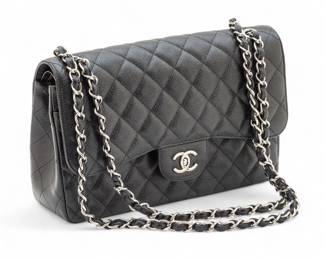 Lot 118
Chanel (French) Black Leather Caviar Quilted Jumbo Double Flap Handbag H 8" L 12.5" Depth 4"