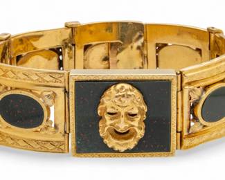 Lot 52
French 18K Yellow Gold Hinged Bacchus Head and Onyx Bracelet L 6" 55 g