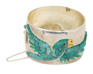 Lot 98
Mexico 950 Sterling Silver and Blue Turquoise Cuff Bracelet, Parrot Design 1950, H 1.7" W 2.6" 128 g 1 PC