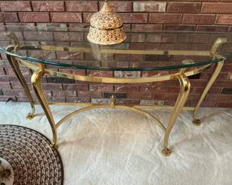 Brass with a heavy glass top accent table