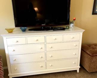 White dresser and TV