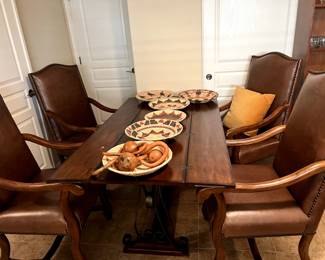 Fold top table with accent chairs and baskets