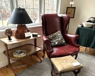 Empire style walnut table with bronze gallery, currule stool, leather wing chair