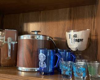 Vintage ice crusher,ice bucket, barware and Shirley Temple glasses.