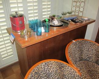 Mid-century solid wood bar with wood top and a lucite protective cover.