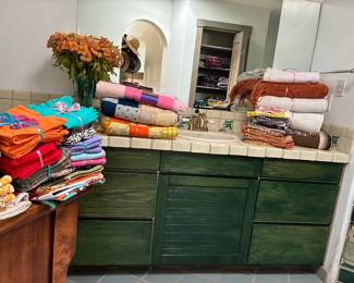 Colorful palette of towels, bedding, quilts, throws, napkins, and more