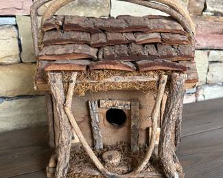 Rustic twig-and-bark birdhouse