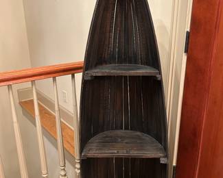 Rustic wooden canoe bookshelf