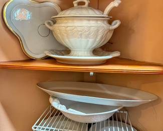 White ironstone soup tureen set, which includes a lidded bowl, an underplate, and a ladle. 