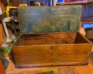 Antique wooden blanket chest with a hinged lid. 