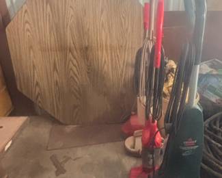 Several vacuum cleaners