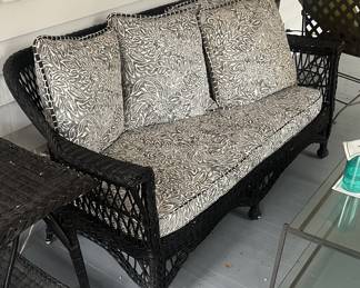 $150 Vintage black rattan sofa; 72" L