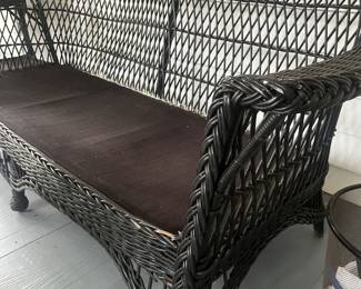 $150 Vintage black rattan sofa; 72" L