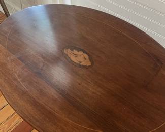 $75 Antique tilt-top tea table; approx. 25" x 26" x 16"