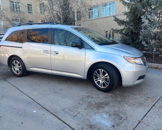 2011 Honda Odyssey EX-L — exceptionally clean with only 43,000 miles and always garage-kept in Santa Fe. This 3.5L V6 F SOHC 24V front-wheel-drive vehicle is being offered at $15,500